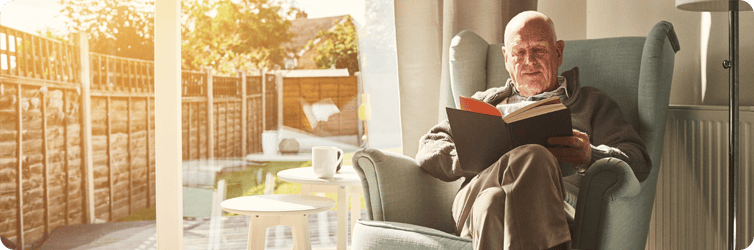 blog - elder man reading in a chair.png